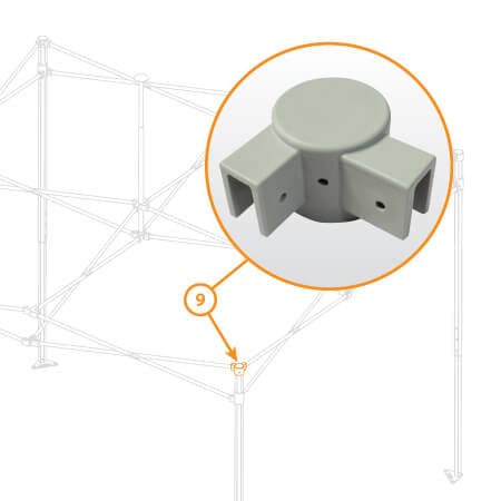 Close-up of the cylindrical gray plastic component labeled as V3 Canopy Frame - Corner Leg Cap - Part #9, featuring three square openings and highlighted in an orange circle. It is part of a structural frame with multiple rods and joints visible in the background.