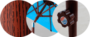 Close-up of a textured brown pole, an umbrella frame with a blue canopy, and a round knob with a red and blue logo.