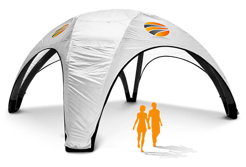 A white custom inflatable tent with a dome shape and four arched entrances features colorful logos on top. Two silhouettes of people in orange walk near its base, highlighting the tent's unique design.