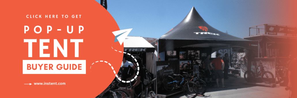 A promotional banner for a pop-up tent buyer guide, featuring an outdoor scene with booth tents and bicycles. Text reads "Click here to get your pop-up tent buyer guide," complete with a website URL.