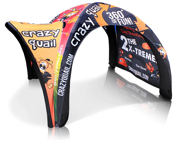 A colorful inflatable structure doubles as unique furniture with Crazy Quail branding, featuring cartoon quail and promising a 360° of Fun experience. It promotes shooting activities and highlights The X-Treme at CrazyQuail.com.