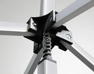 Close-up of a 10 x 10 pop up canopy tent frame showcasing metal rods linked by a black plastic connector and a central coil spring. The rods form a cross pattern against a plain background, highlighting the sturdy construction of this 10 x 10 tent.