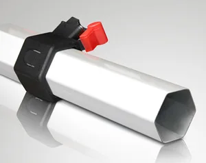 Close-up of a metal pipe with a hexagonal cross-section, fitted with a black clamp and a red lever, reminiscent of the sturdy framework found in a 10 x 10 pop up canopy tent. The pipe is positioned diagonally against a light gray background.