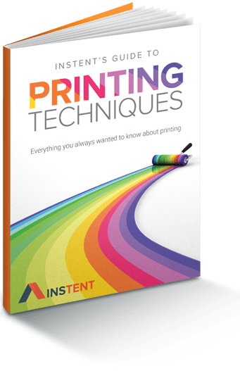 Book cover titled "Instents Guide to Printing Techniques," with a colorful paint roller creating a rainbow path, reminiscent of the vibrant design you'd find on a 10 x 10 canopy. Subtitle reads, "Everything you always wanted to know about printing.