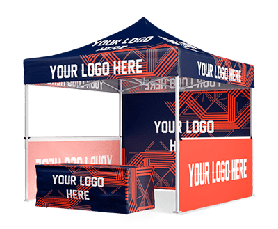 A custom tent with blue and red geometric designs showcases the text YOUR LOGO HERE. It features a counter and back panel with matching designs, perfect for an event or trade show. Ideal for those seeking bespoke canopies to make their brand stand out.