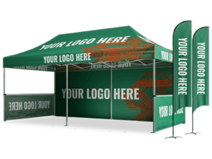 The 10'x20' Elite Package features a green outdoor promotional tent with your logo printed on the canopy and side walls. Additionally, two vertical flags with your logo are positioned on the right side, and the setup includes a counter or table space.