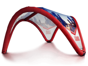 The Airwave Inflatable Canopy - Fully Printed is a red promotional tent with transparent panels displaying cityscape images and customizable text. It features an arch-like design and is showcased against a plain white background.